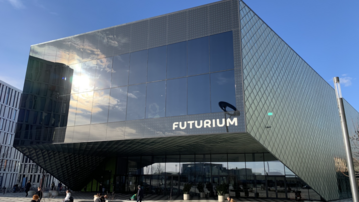 Futurium building with modern architecture, large glass surfaces, and the inscription 'FUTURIUM' on the facade.