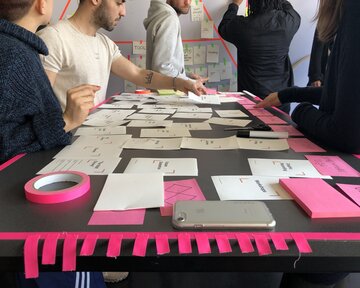 Master's students in Design Strategy engage in teamwork.